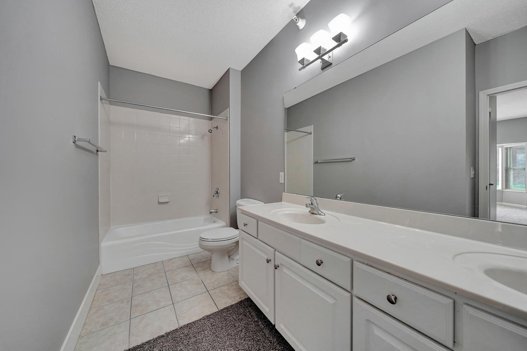 a bathroom with a sink toilet and a shower