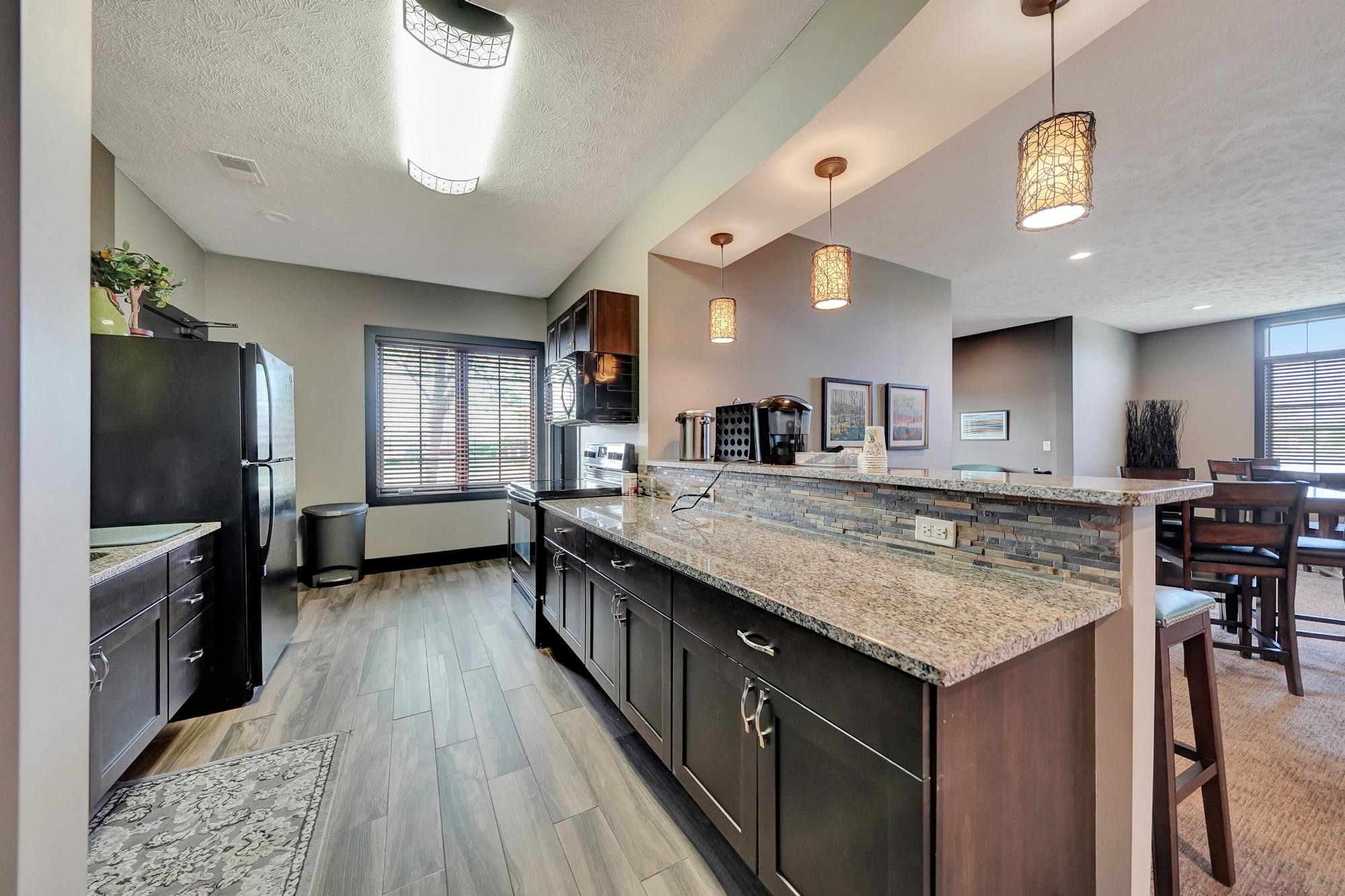 a kitchen with a counter top and a refrigerator