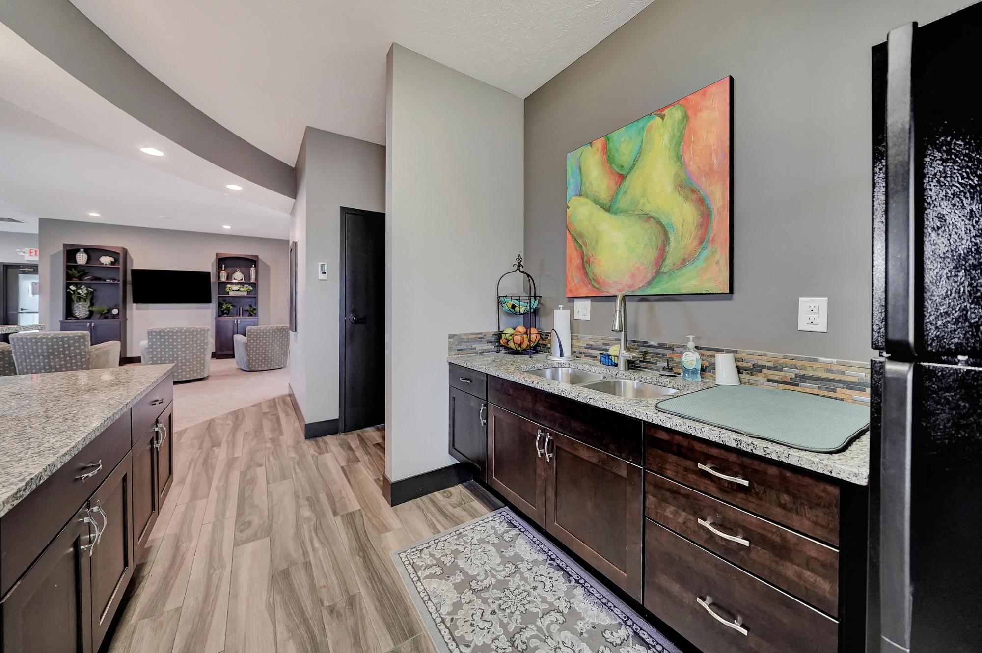 a kitchen with a counter top and a refrigerator