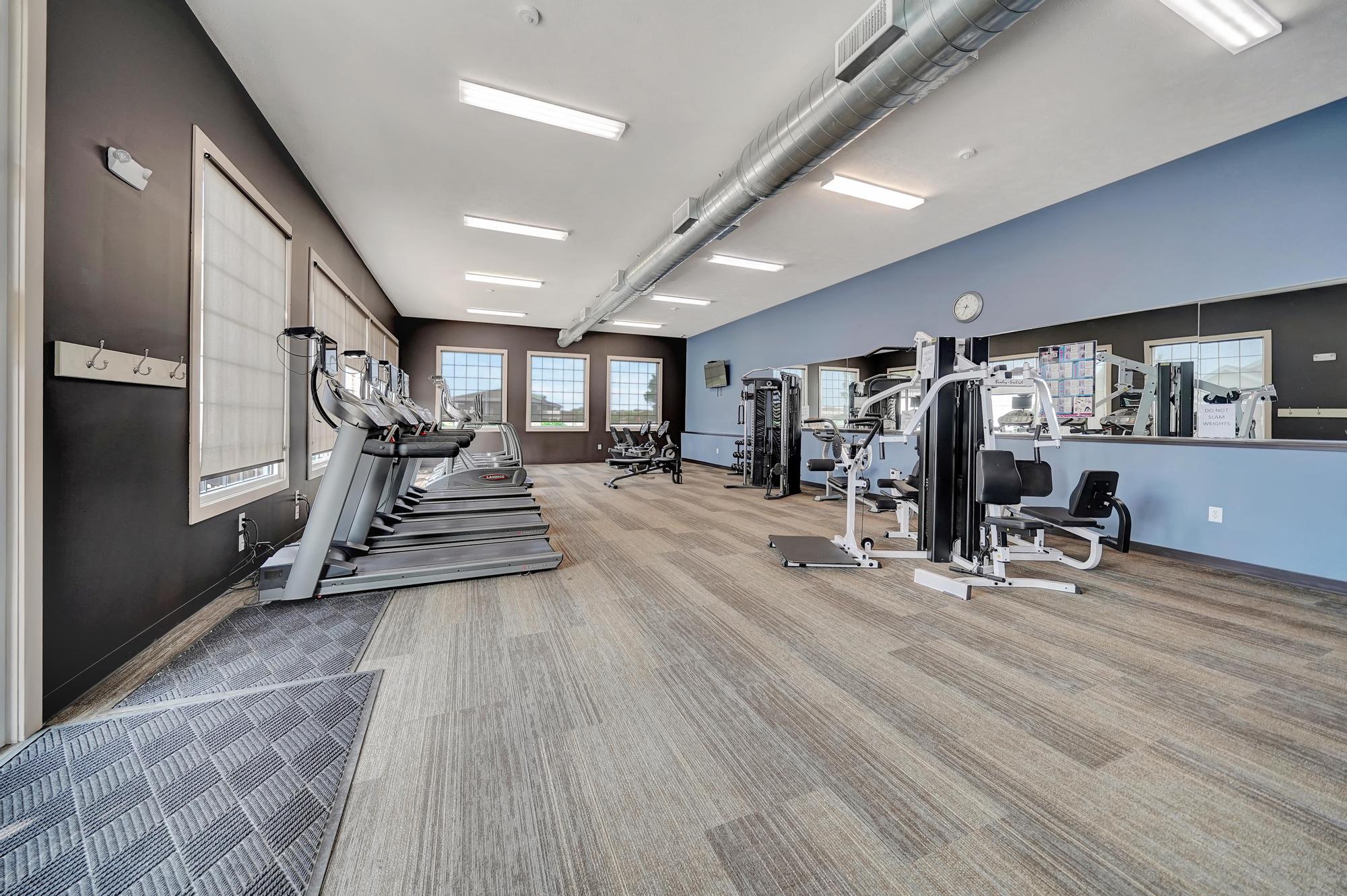 the gym at the flats at big tex apartments