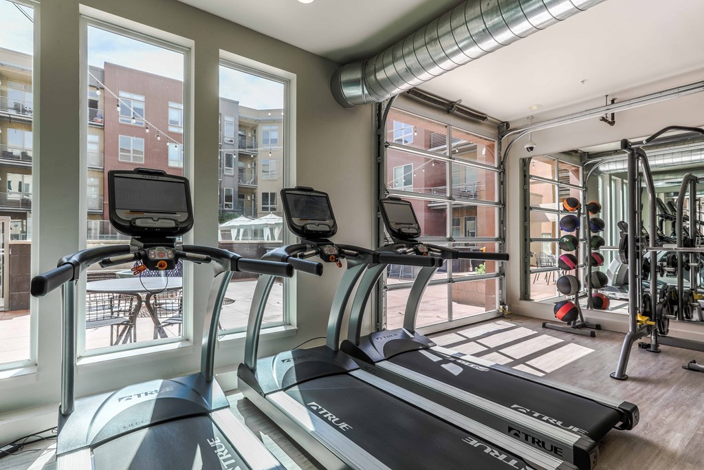 the gym at the district flats apartments in lenexa