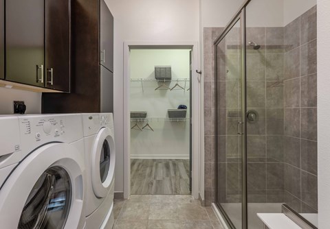 A modern laundry room with a washer and dryer.