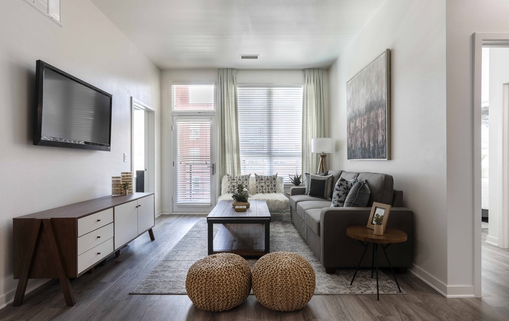 a living room with a couch and a tv
