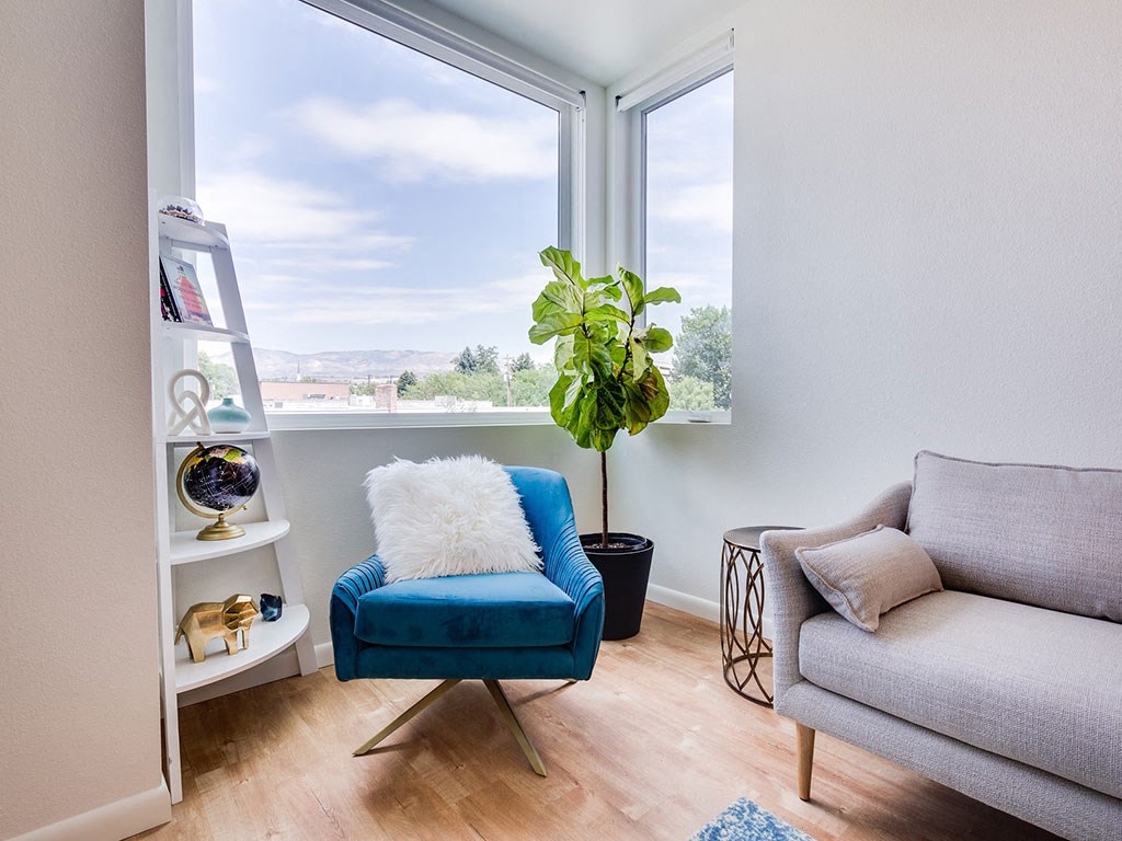 Living Room Sofa And Glass Window at The Watercooler Apartments, Boise 83702