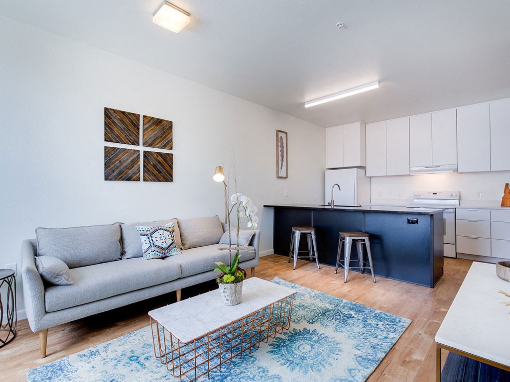 Living Room With Kitchen View at The Watercooler Apartments, Boise, ID
