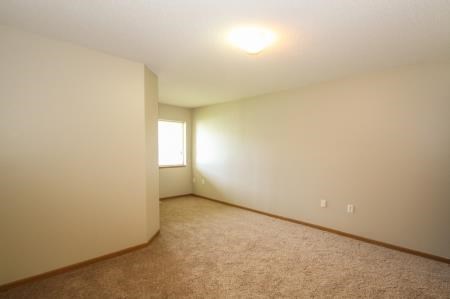 a large empty room with a window in it
