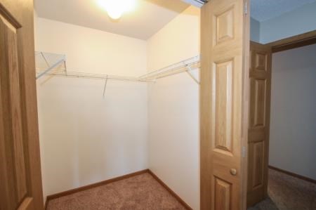 a white room with a closet and a door