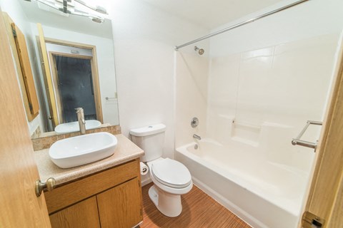a bathroom with a sink toilet and a bath tub