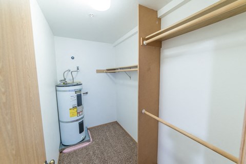 a bathroom with a shower and a water heater in it