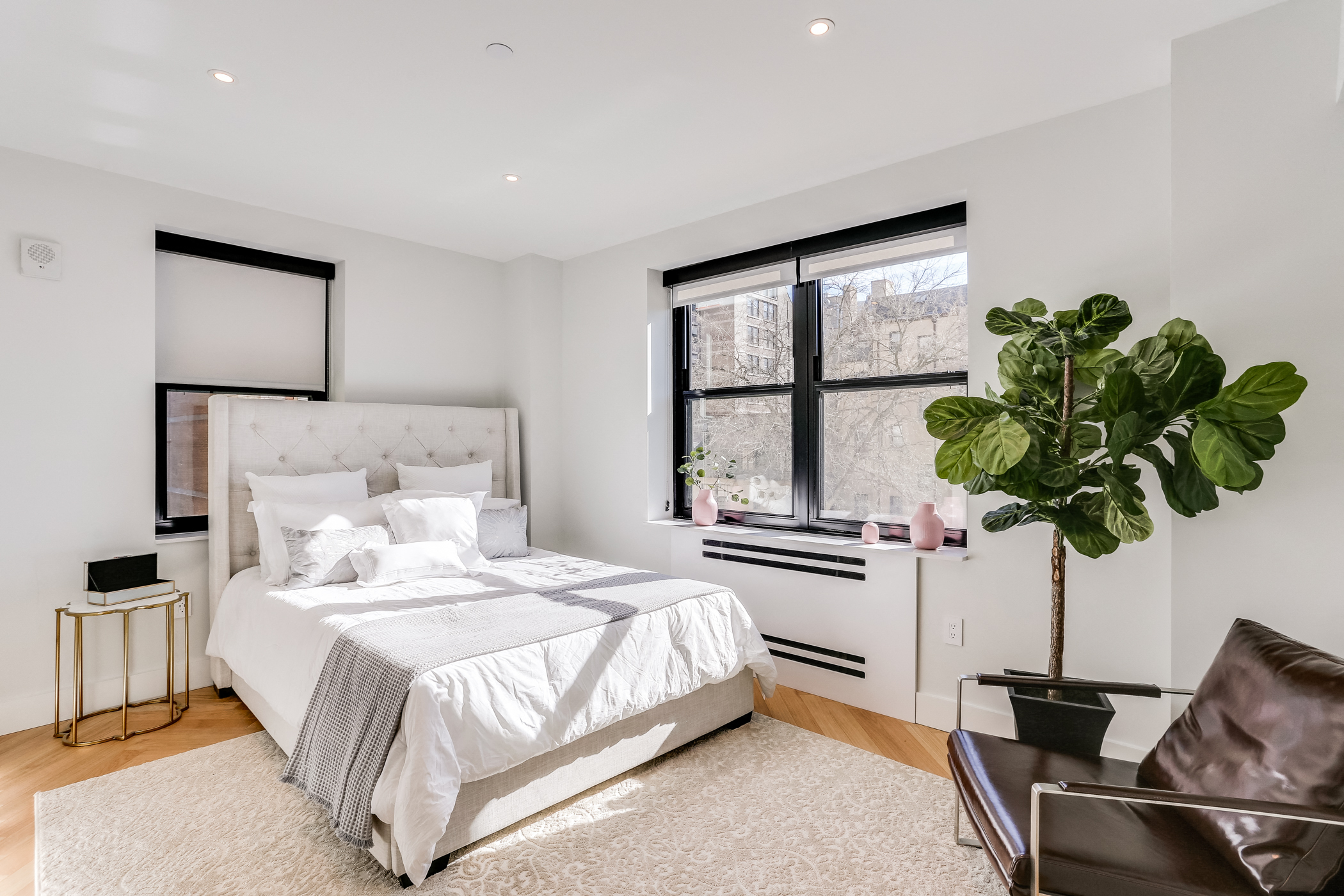 Sun filled one bedroom apartment with hardwood floors and custom closets