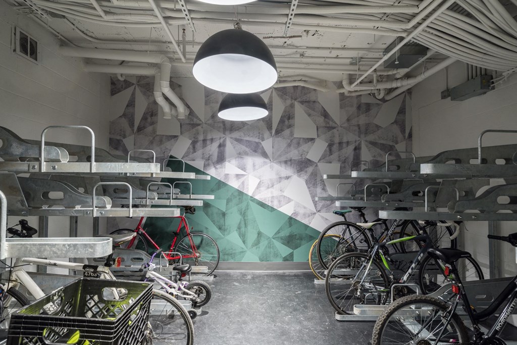 a room with bikes and a wall with a geometric design