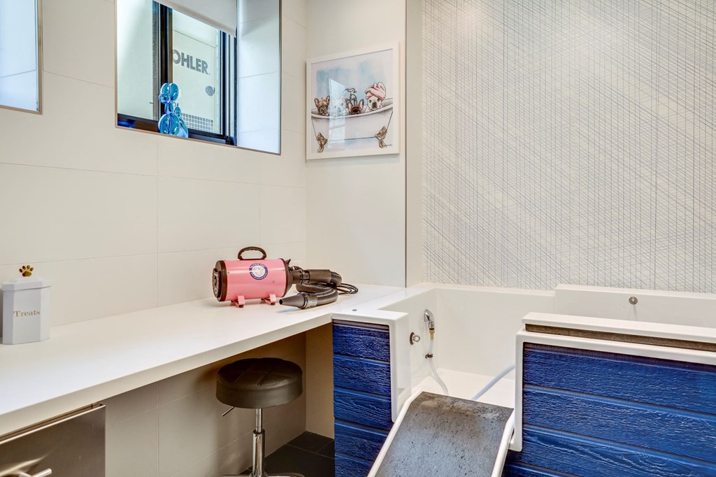 a kitchen with a counter and a pink suitcase on it
