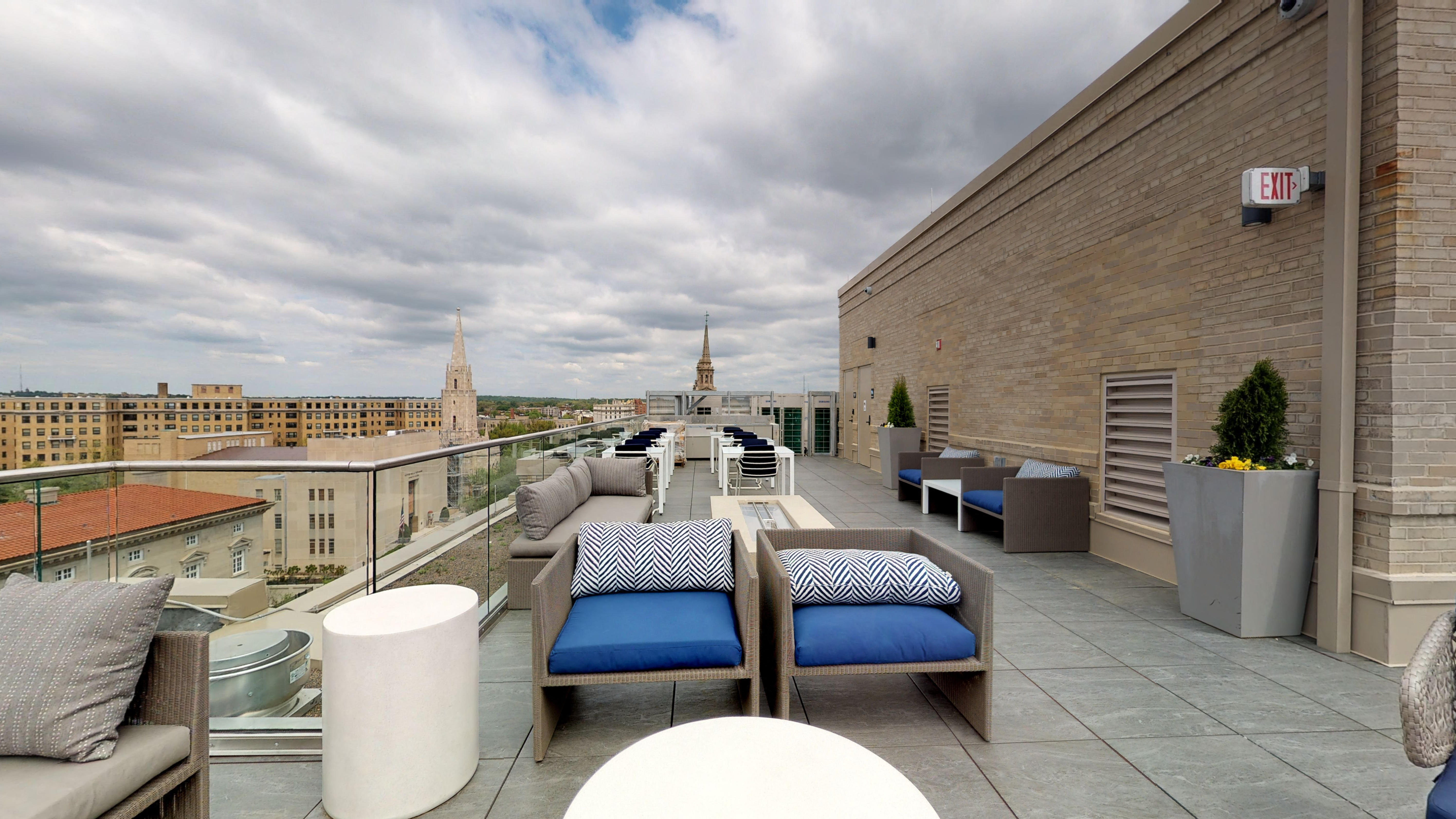 rooftop lounge and fire pit grill stations outdoor seating space