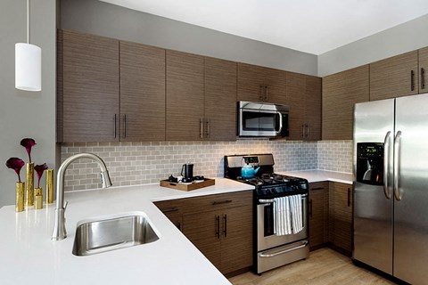 a kitchen with stainless steel appliances and a sink