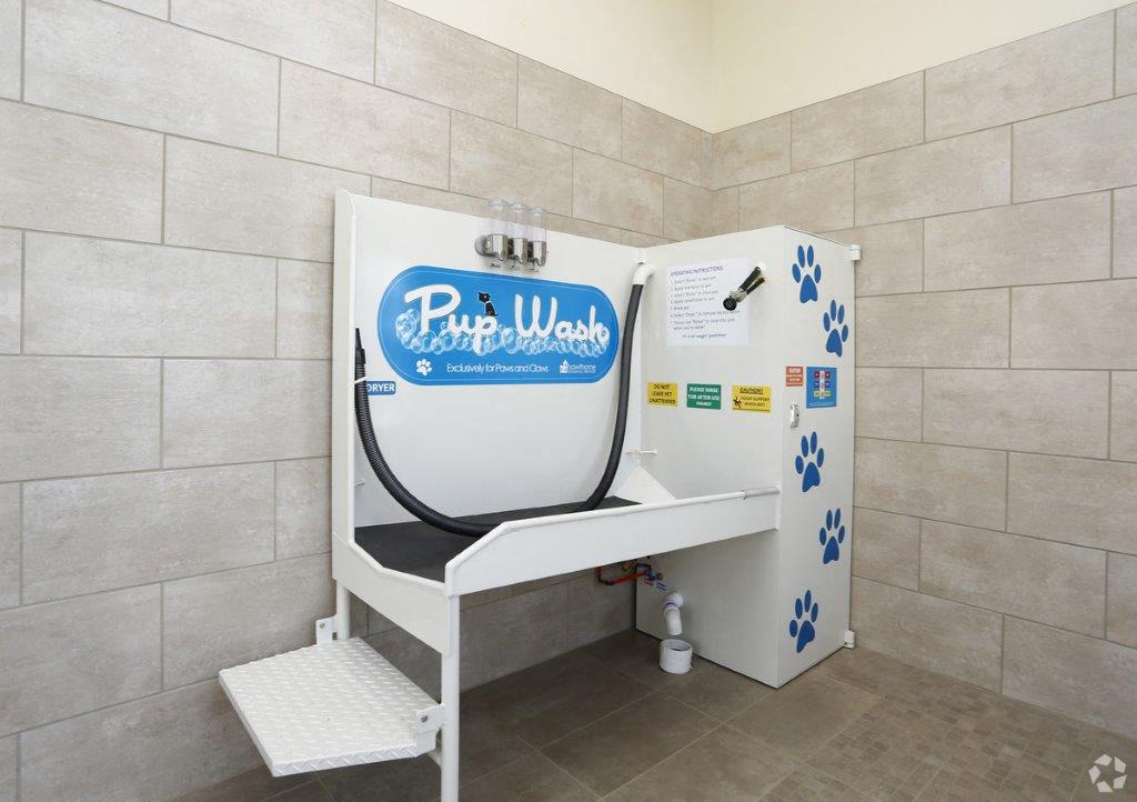 a public restroom with a urinal and a sink