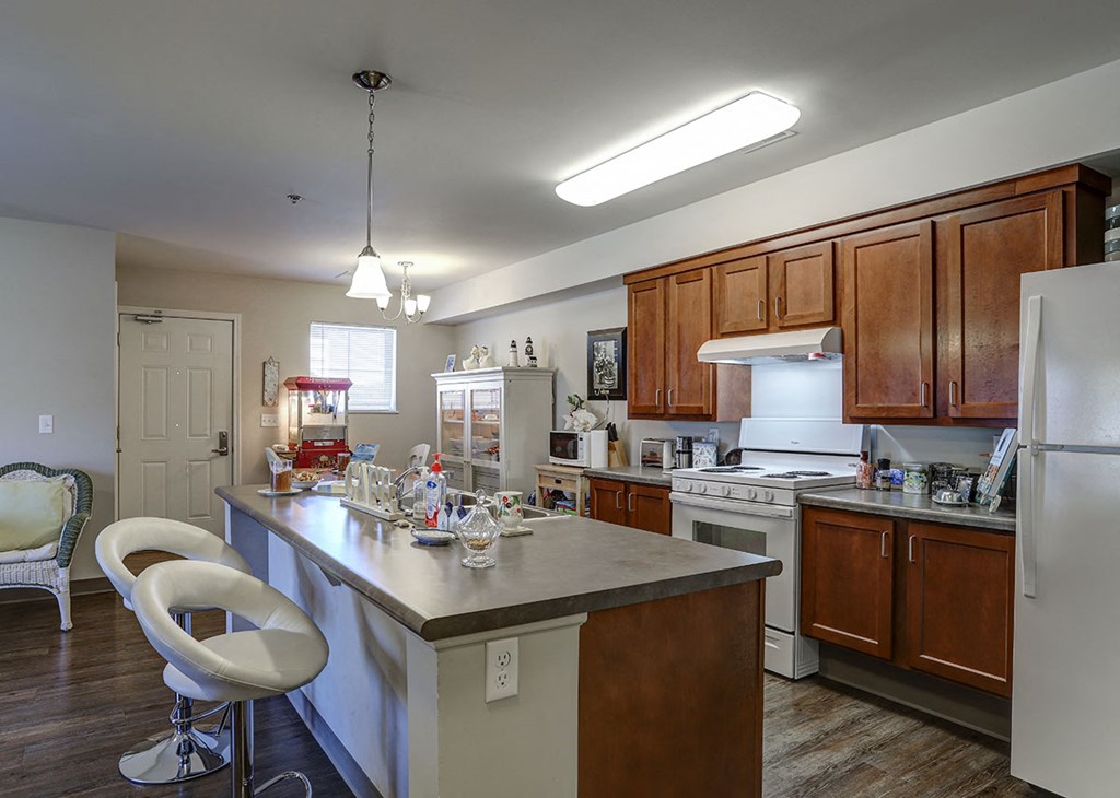 a kitchen with a counter top and a refrigerator