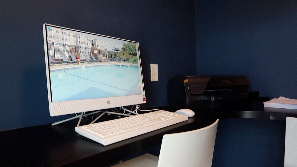 a desktop computer sitting on a desk with a keyboard and mouse