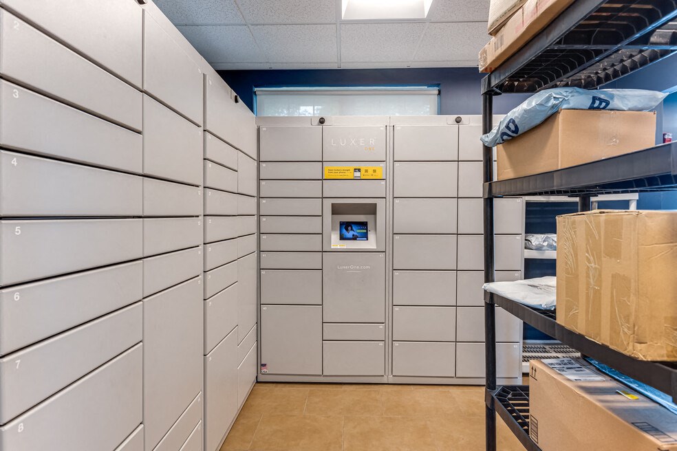 a storage room with boxes on shelves and a machine in the back