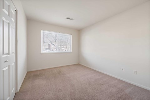 a room with carpet and a window