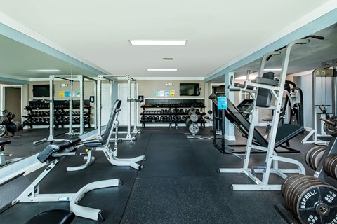 a gym with weights and other workout equipment