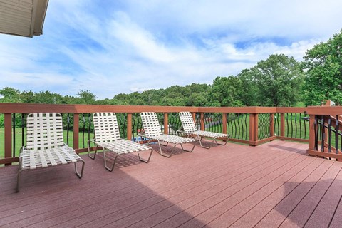 a group of chairs sitting on a deck