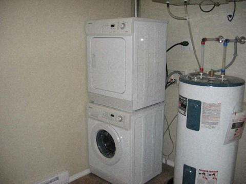 a washing machine and a dryer in a room