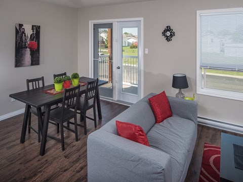 a living room with a couch and a dining room table