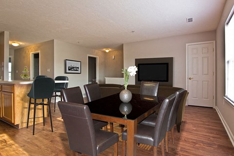 a dining room with a table and chairs