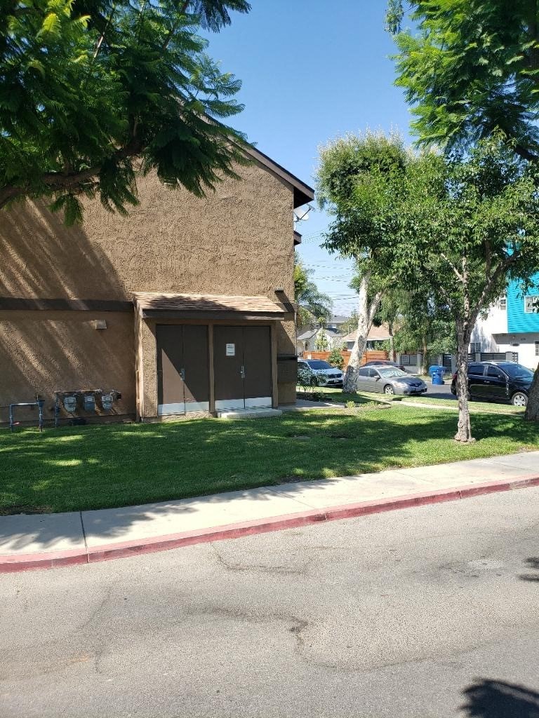 a brown building on the side of a street