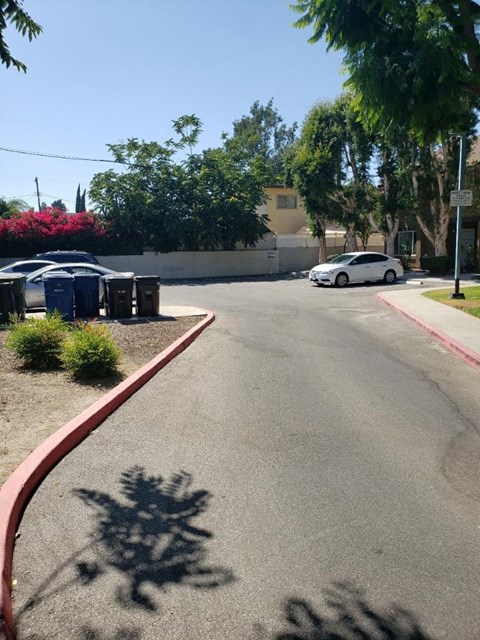 a street with a car parked on the side of it