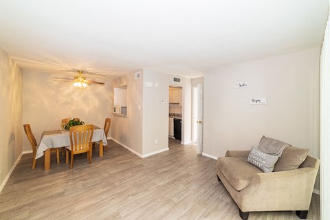 Living Room With Dining Area at Carelton Courtyard Apartments, Galveston