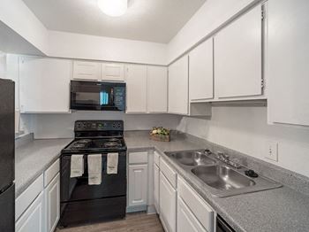 fully equipped kitchen at Carelton Courtyard Apartments Galveston, TX