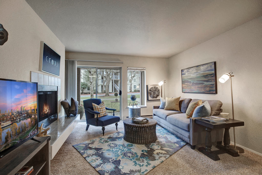 a living room with a couch and a fireplace