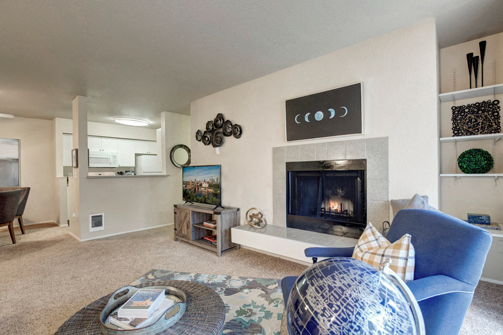 a living room with a fireplace and a couch