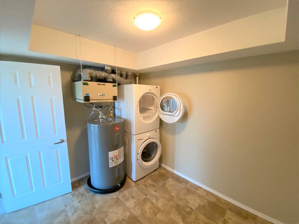 a laundry room with a washing machine and a dryer