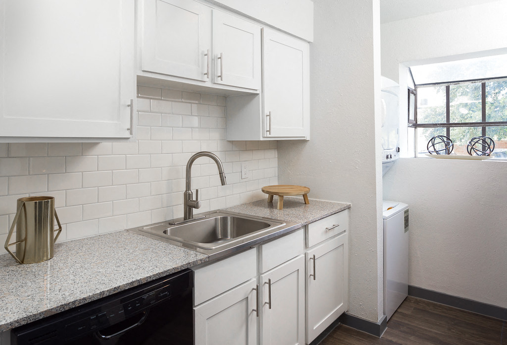 Kitchen With White Cabinetry And Appliances at The Ivy, Austin, TX