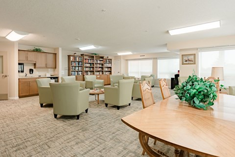 A conference room with a long table and chairs.