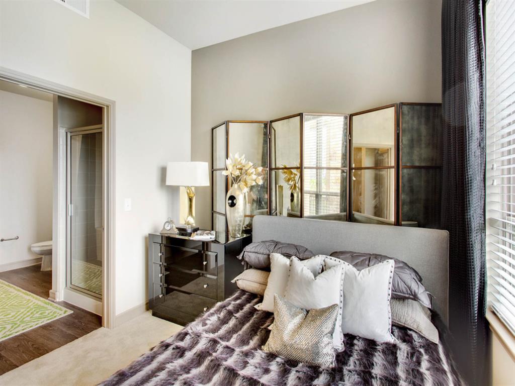 bedroom with adjacent bathroom