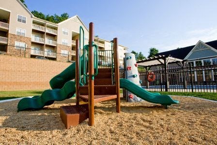 a playground with a slide and other toys