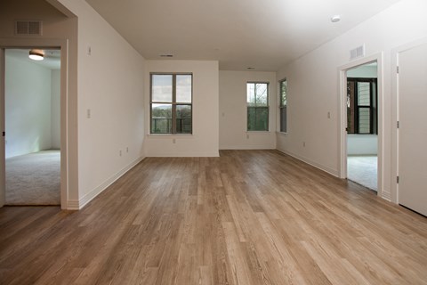A room with wooden floors and white walls.
