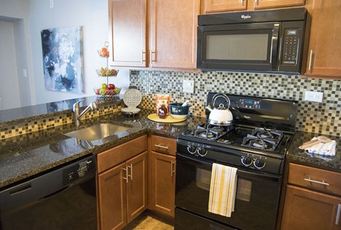 a kitchen with a stove and a microwave
