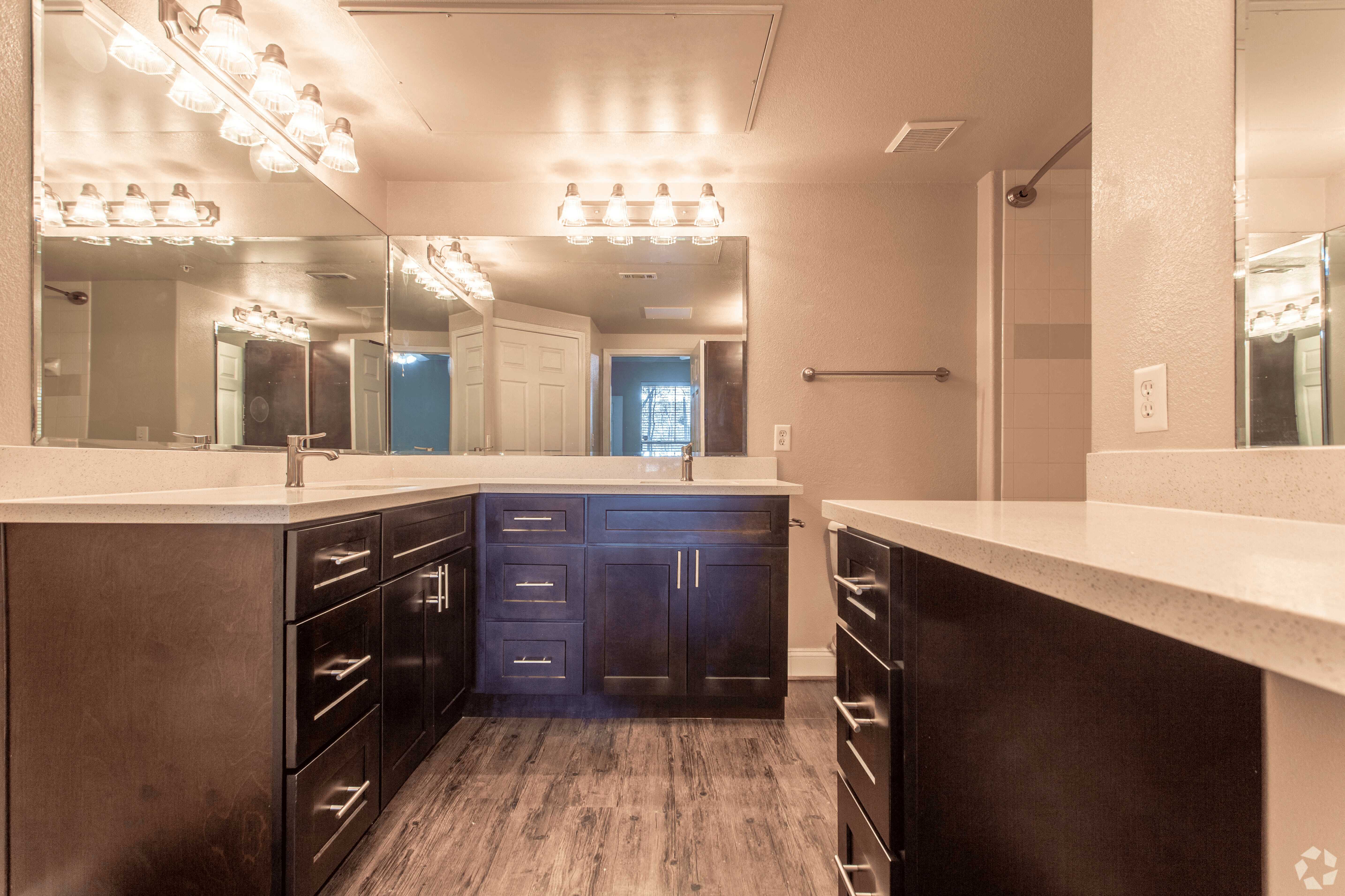 a large bathroom with a sink and a mirror