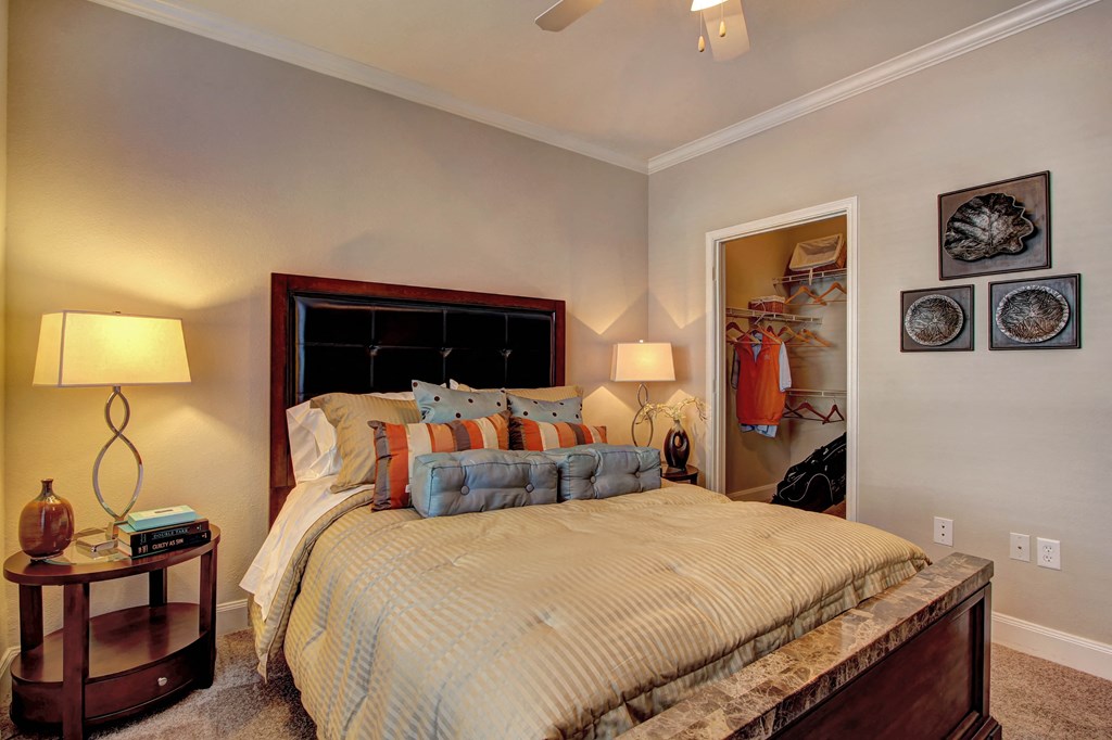 a bedroom with a bed and a closet