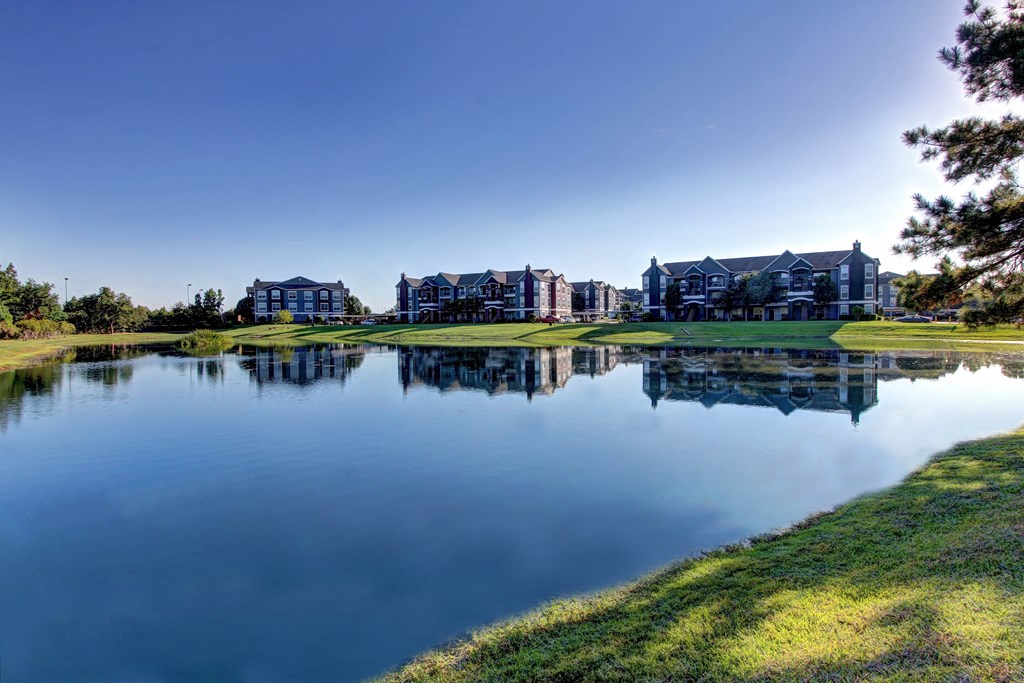 a view of a lake with houses in the background