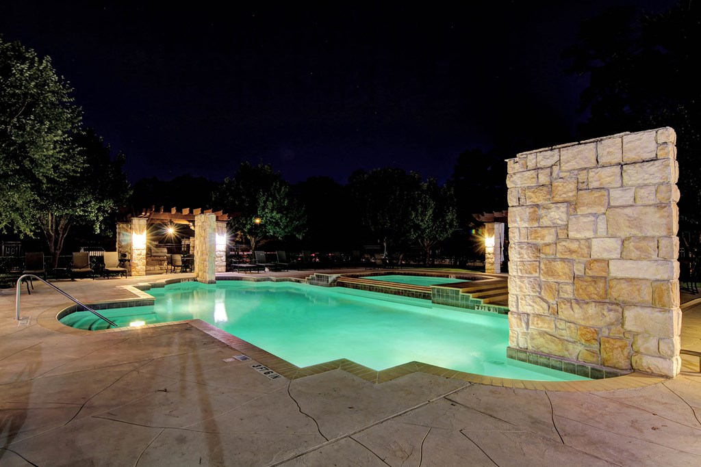 the swimming pool at night at the resort at night