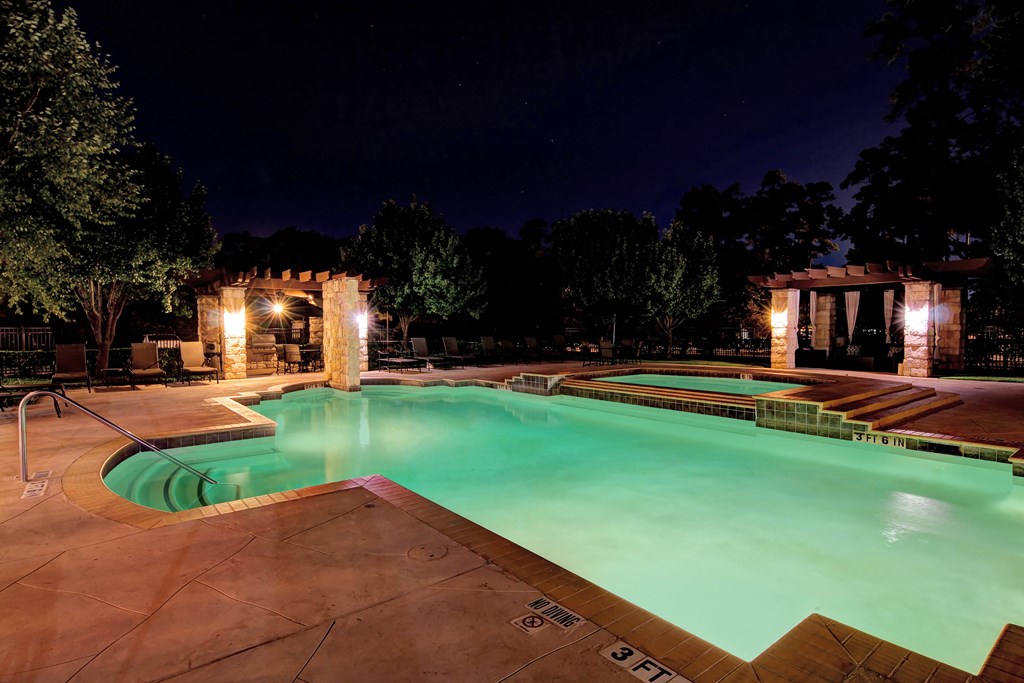 the swimming pool at night at the resort at night