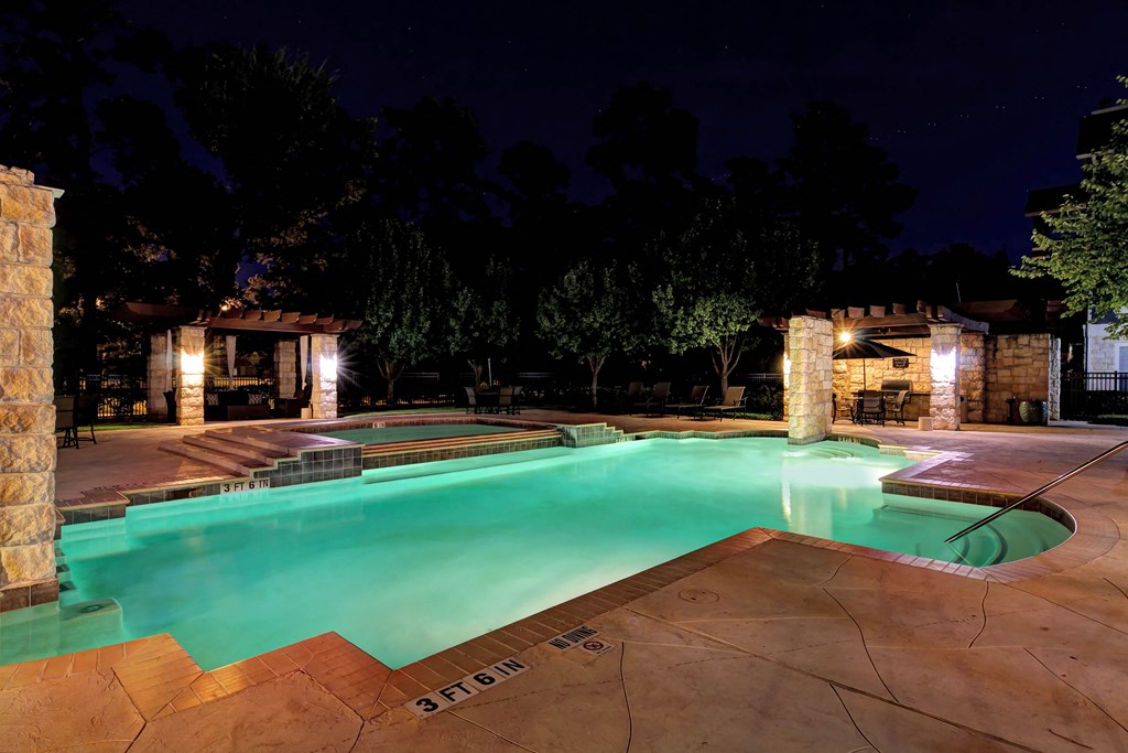 a swimming pool at night at the resort at night