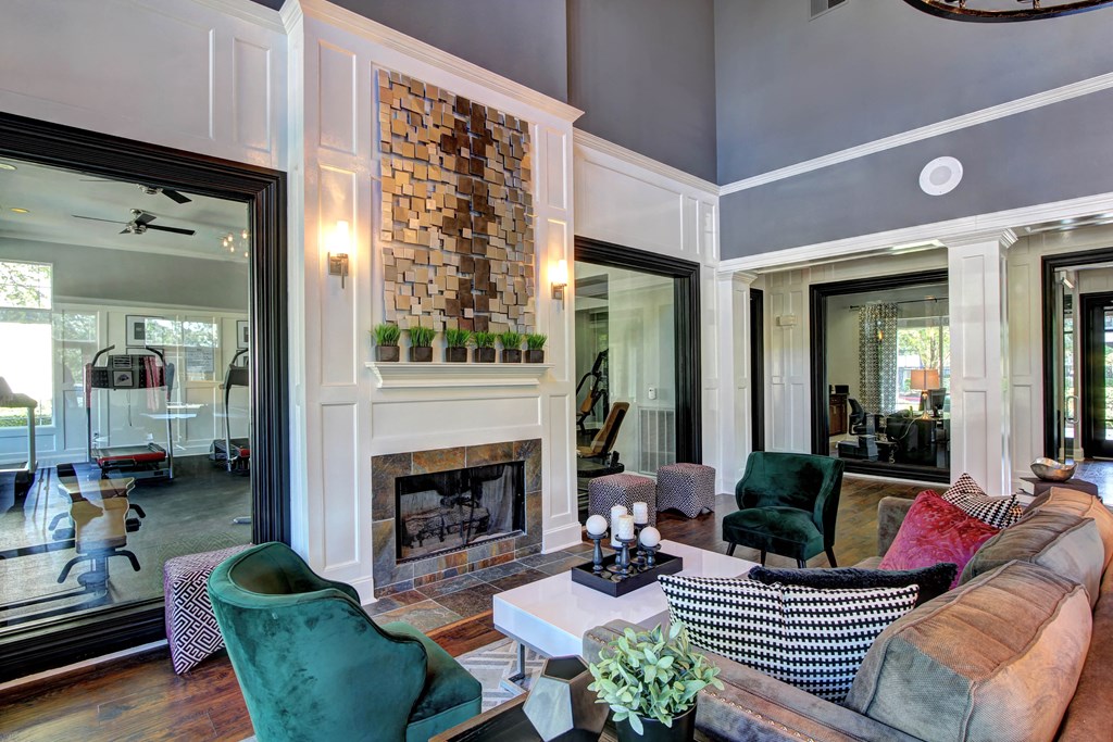a living room with a couch and a fireplace