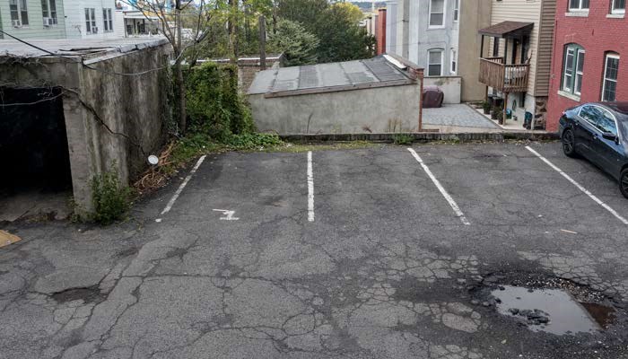an empty parking lot with a car in it
