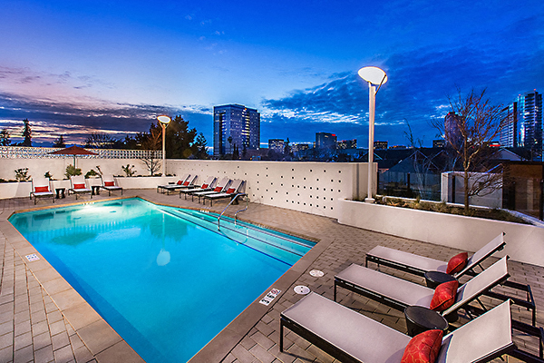 Outdoor pool area with lounge chairs